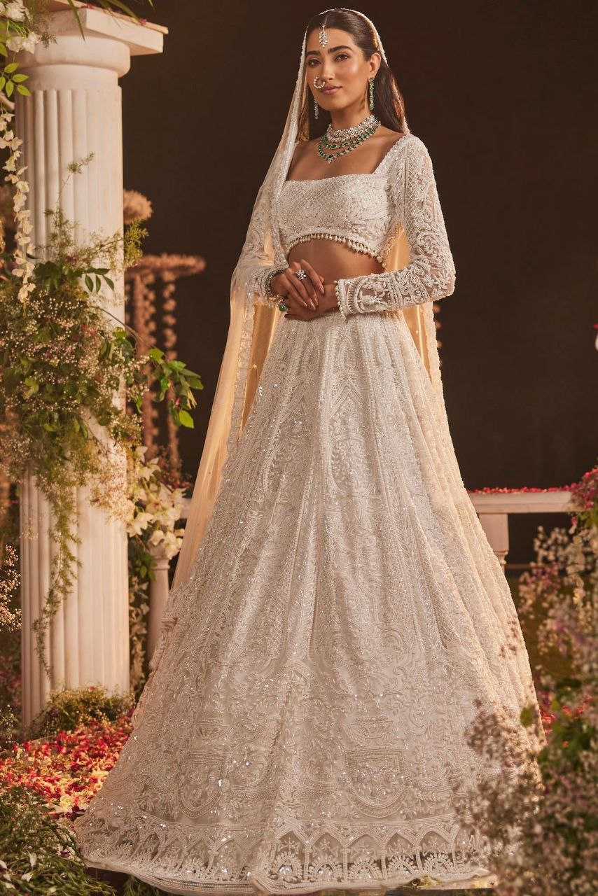 YNF GEORGETTE RIN121 1007 LEHENGAS WHOLESALE WEDDING DESIGNER EMBROIDERED NET FANCH SEQUNIS WHITE LEHENGAS MANUFACTURER - Deevit International