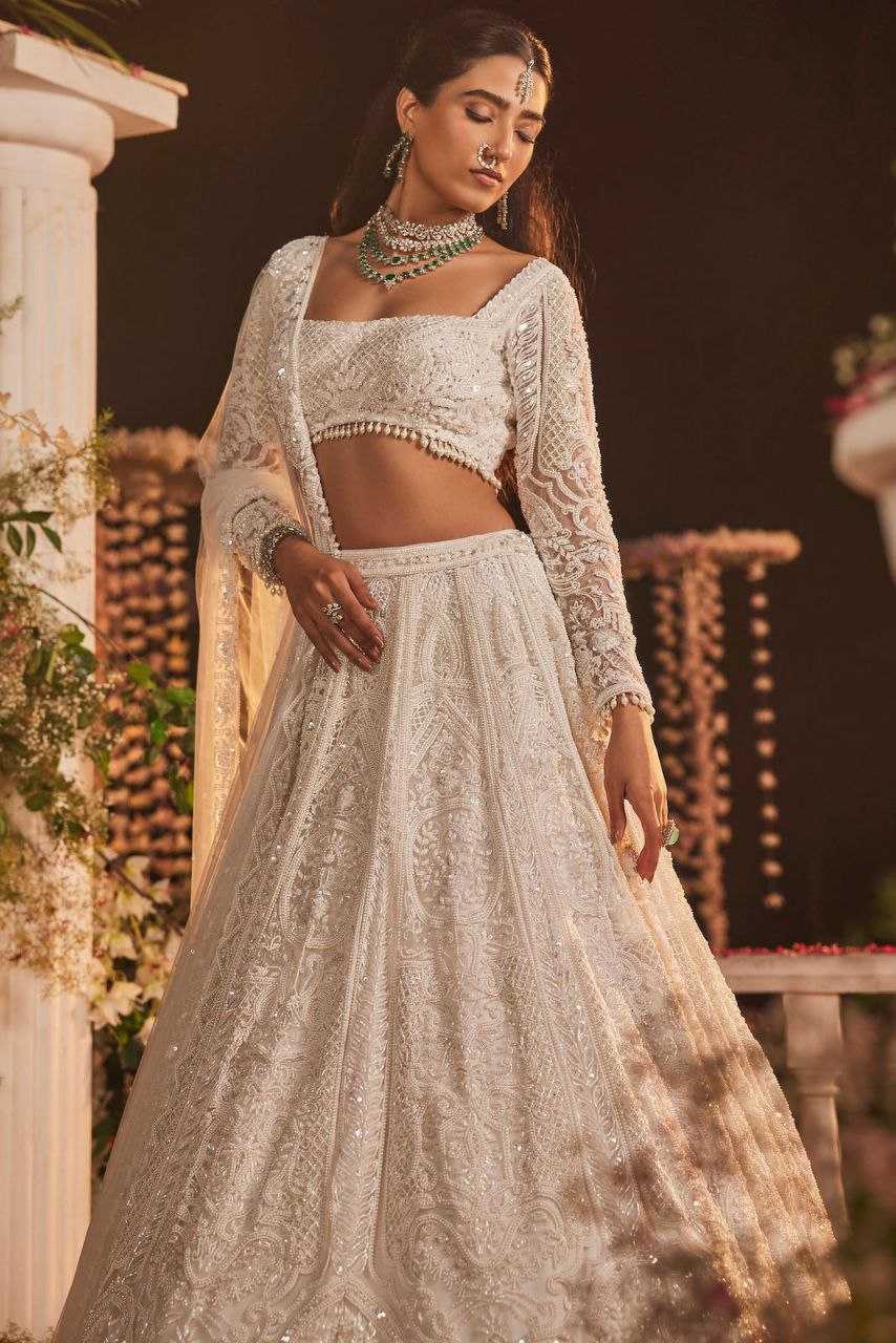 YNF GEORGETTE RIN121 1007 LEHENGAS WHOLESALE WEDDING DESIGNER EMBROIDERED NET FANCH SEQUNIS WHITE LEHENGAS MANUFACTURER - Deevit International