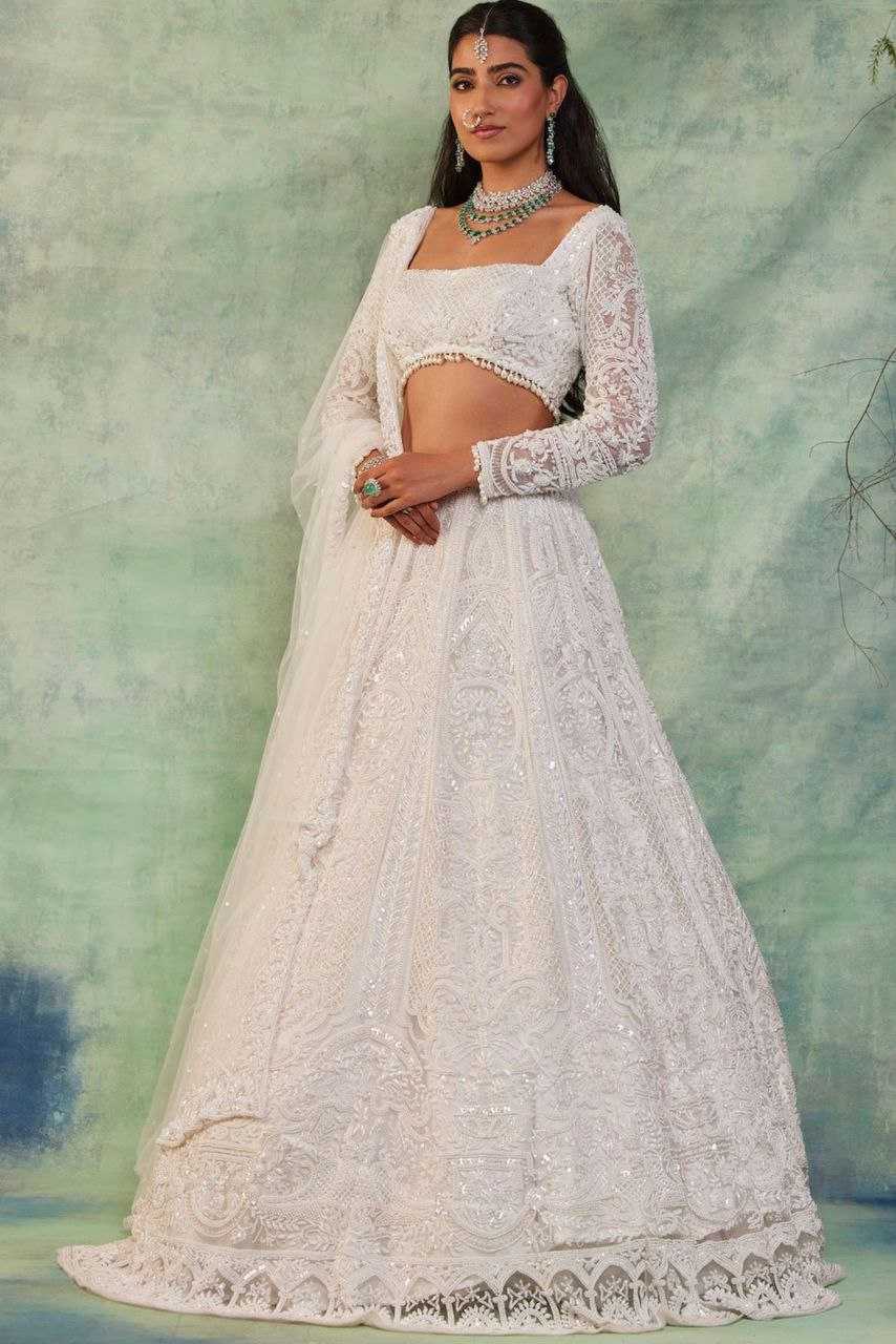 YNF GEORGETTE RIN121 1007 LEHENGAS WHOLESALE WEDDING DESIGNER EMBROIDERED NET FANCH SEQUNIS WHITE LEHENGAS MANUFACTURER - Deevit International